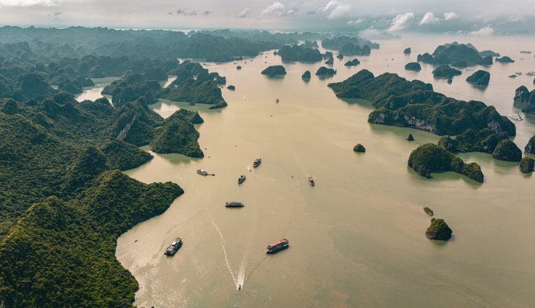 Aerial view capturing the stunning limestone islands and tranquil waters of Halong Bay, Vietnam.