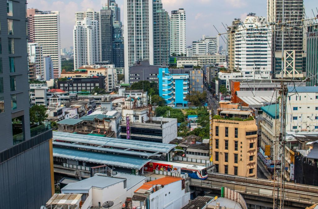 View of Bangkok's skyline showcasing the BTS Skytrain station and vibrant architecture.