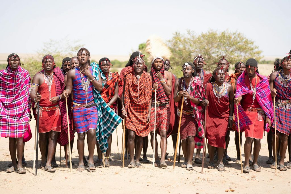 Masai Tribe in traditional attire during a cultural gathering in Kenya's wilderness.